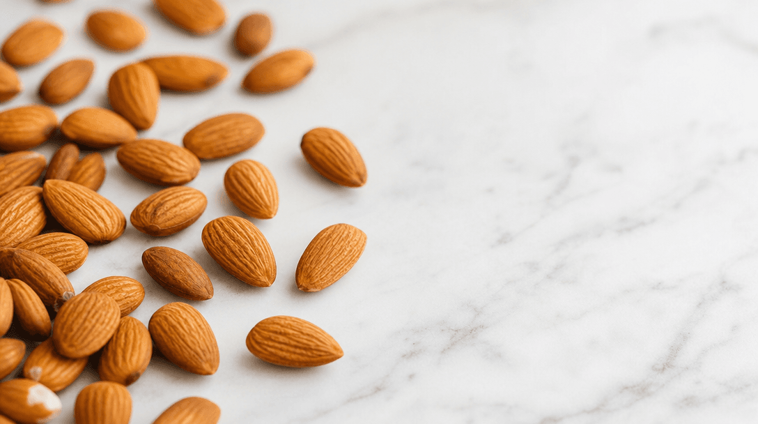Premium California almonds scattered on marble